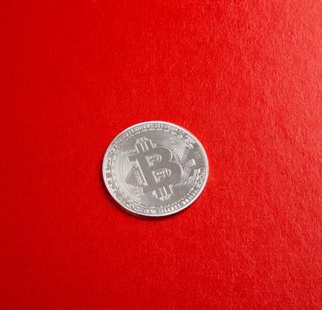 close up on bitcoin on red background