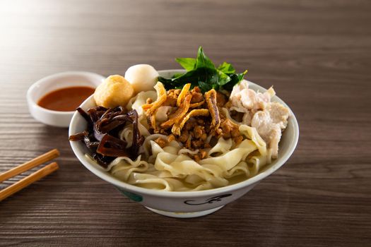 Pan Mee is made with a simple flour-based dough, with anchovy broth, and topped with crispy fried anchovies, ground pork, shiitake mushrooms, and some vegetables.