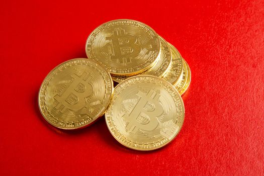 close up on bitcoin on red background
