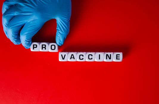 Pro-vaccine symbol. Doctor hand  with words 'pro-vaccine'. Medical covid-19 pro-vaccine concept.