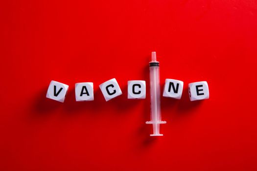 Medical covid-19 concept. Needle  with words 'vaccine'.