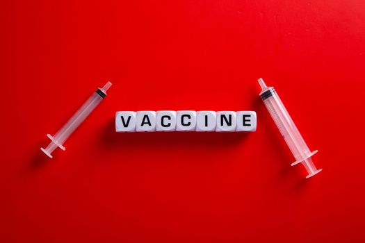 Medical covid-19 concept. Needle  with words 'vaccine'.