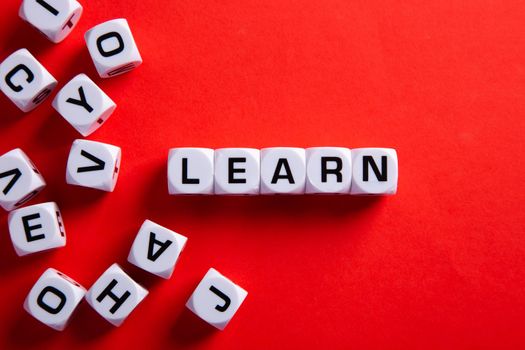 Learn words on red background. Education concept.
