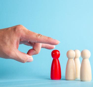 The boss’s big hand flicking the dismissed employee. Crisis and unemployment,
