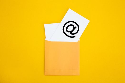 Envelope with email symbol on yellow background - Concept of corporate communication