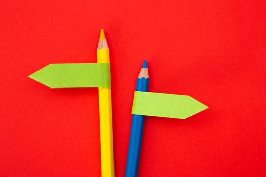 color pencil with direction indicator on color background
