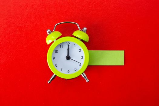 Alarm clock on red background. Copy Space