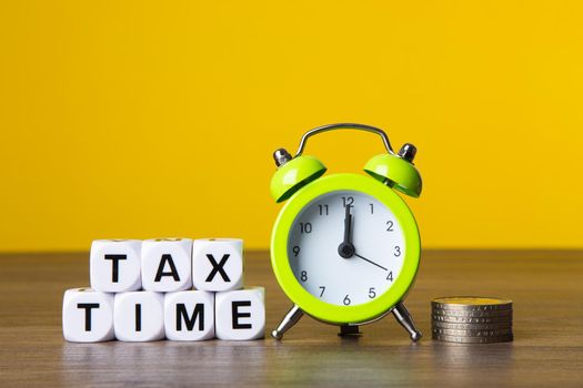 Time For Taxes Reminder Concept on yellow background