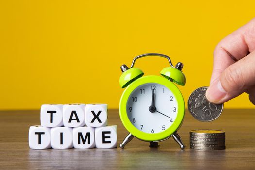 Time For Taxes Reminder Concept on yellow background
