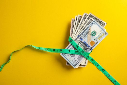 Money with a tape measure. Inflation rates. Price growth.