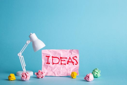 Ideas of creativity concepts with paper crumpled ball and lamp. Business solution