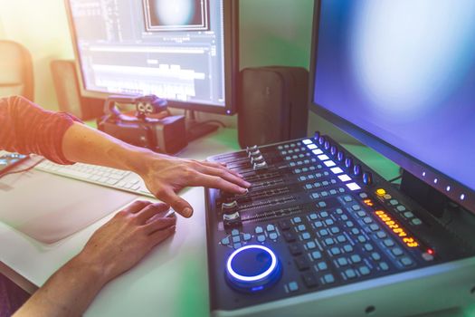 Video editing, recording and cutting room with monitors and sound mixing desk