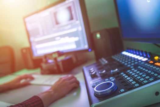 Video editing, recording and cutting room with monitors and sound mixing desk