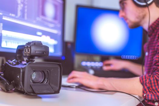 Video editing, recording and cutting room with monitors, camera and sound mixing desk