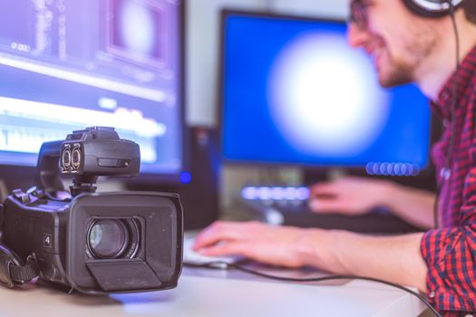 Video editing, recording and cutting room with monitors, camera and sound mixing desk