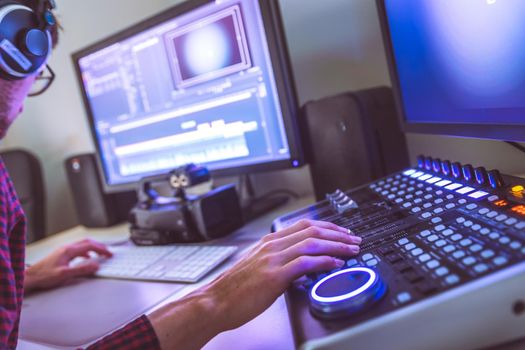 Video editing, recording and cutting room with monitors and sound mixing desk
