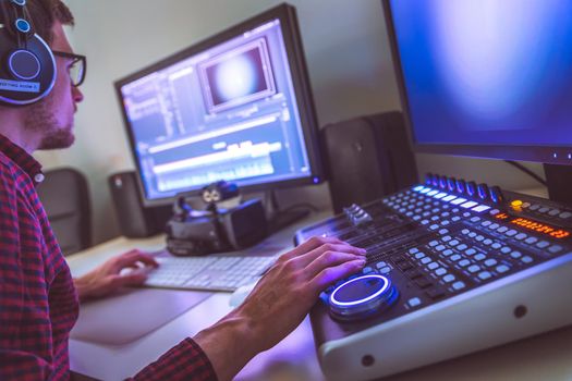 Video editing, recording and cutting room with monitors and sound mixing desk