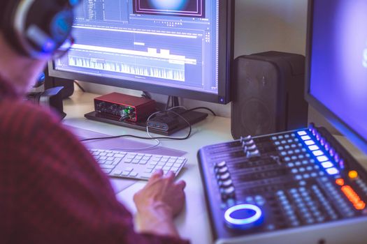 Video editing, recording and cutting room with monitors and sound mixing desk