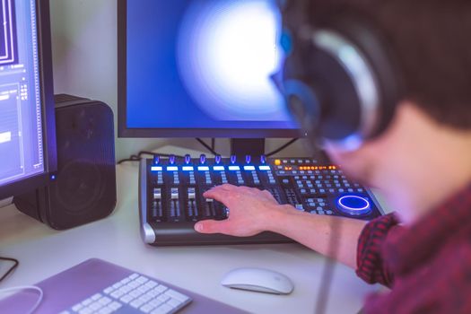 Video editing, recording and cutting room with monitors and sound mixing desk