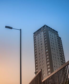 A Tower Block In A Public Coucil Estate In The UK At Dusk, With Copy Space