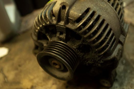 Old worn alternator of the car to be replaced