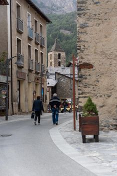 Ordino, Andorra: 2021 March 30: People walking down the street in spring in Ordino, Andorra in the Pyrenees in 2021.