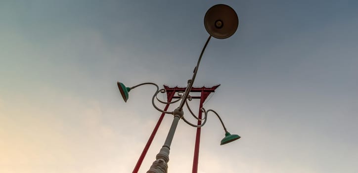 Bangkok, Thailand - Nov 23, 2019 : Vintage street lamp in front of The Giant Swing or "Sao Chingcha".