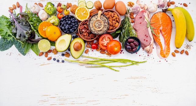 Ketogenic low carbs diet concept. Ingredients for healthy foods selection on white wooden background. Balanced healthy ingredients of unsaturated fats for the heart and blood vessels.