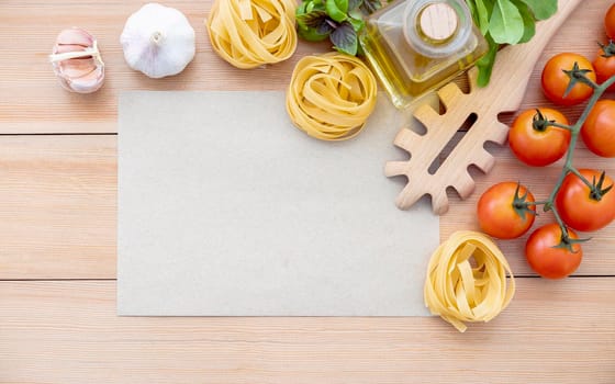 Italian foods concept and menu design . The ingredients for homemade pasta with copy space on wooden background.