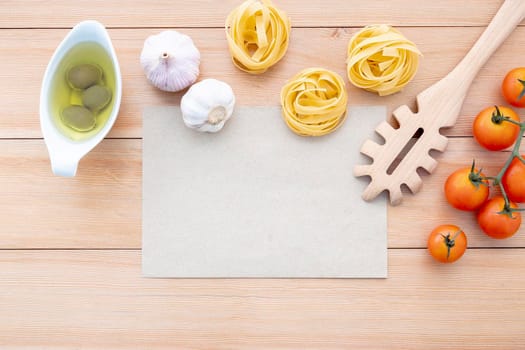 Italian foods concept and menu design . The ingredients for homemade pasta with copy space on wooden background.