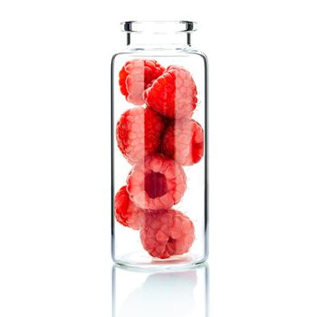  Homemade skin care with raspberry in a glass bottle  isolate on white background.