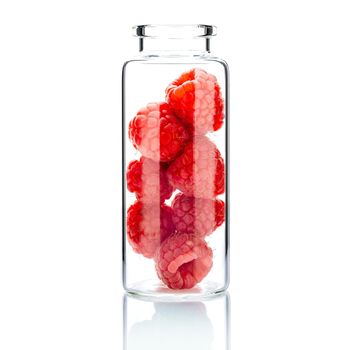  Homemade skin care with raspberry in a glass bottle  isolate on white background.