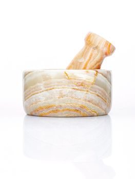 Closeup marble mortar and pestle isolated on white background . 