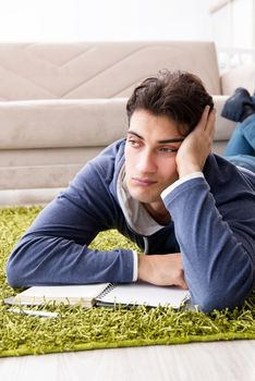 Handsome student working at startup project at home 