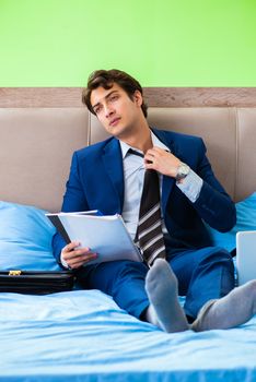 Businessman working in the hotel room
