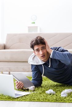 Handsome student working at startup project at home 