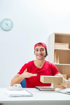 Call center worker at parcel distribution center in post office