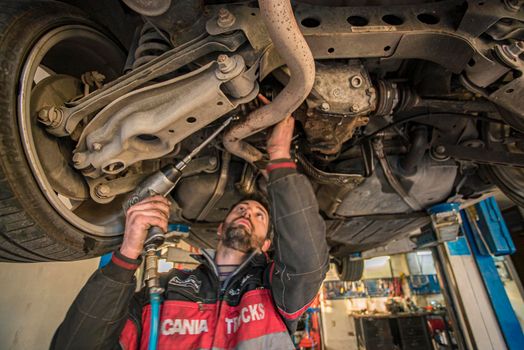 MILAN, ITALY 28 MARCH 2021: Mechanic repairs the car