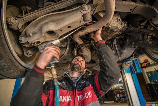 MILAN, ITALY 28 MARCH 2021: Mechanic repairs the car