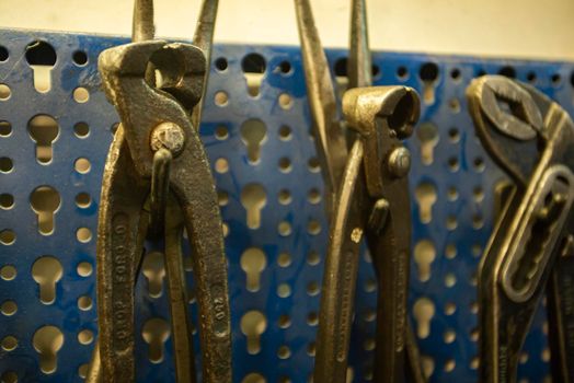 MILAN, ITALY 28 MARCH 2021: Tools hanging in the workshop