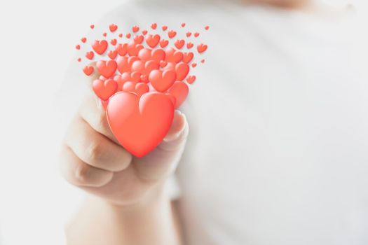 Hand holding a red heart of valentine's day concept