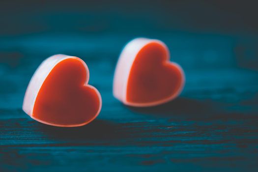 Couple heart is candles on dark background