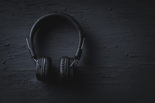 Music relax concept, Headphone on dark texture background