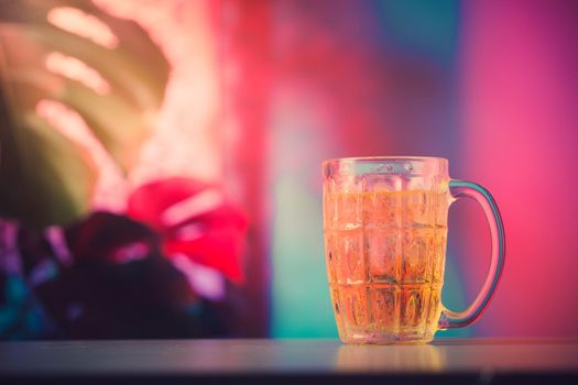 Whisky drink with colorful lighting background