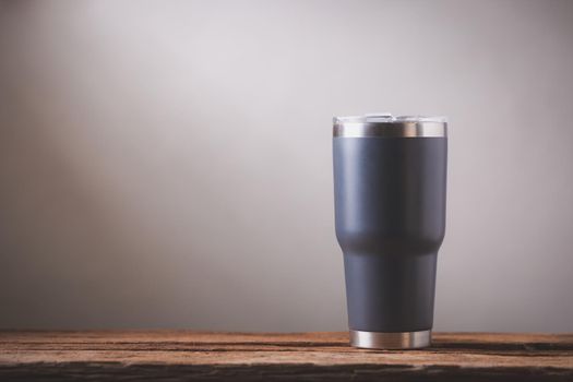 Black Cold Cup or Steel mug on wood table