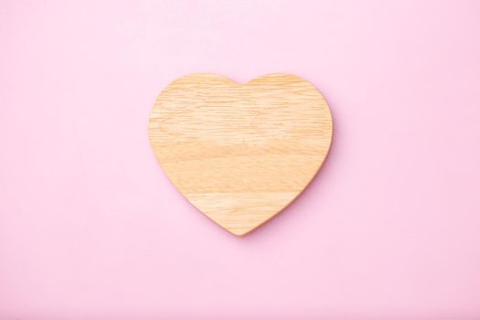 Heart wooden empty for message on pink background, Mother's Day and Valentines Day concept