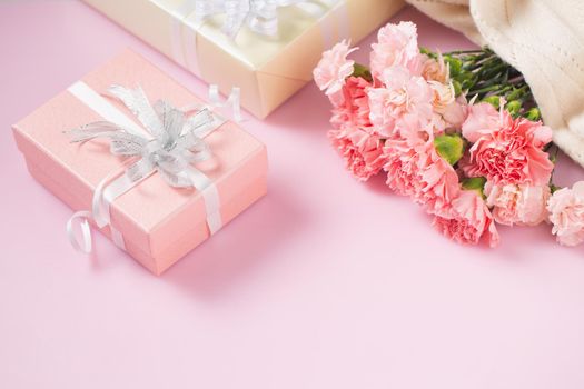 Gift box with carnation flowers, Mother's Day and Valentines Day concept