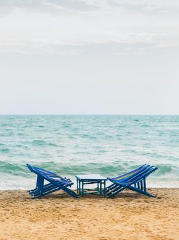 Beach chair in front the sea with come in summer