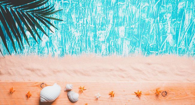 Summer background , Palm branch on sea sand background, space for text