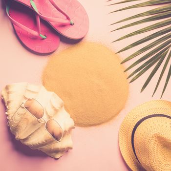 Beach hat, coconut leaves and glasses on pink background In the summer concept, copy space, top view, minimal style, Glasses beach